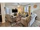 Comfortable living room featuring plush seating, a ceiling fan, and decorative accents at 102 Dogwood Trl, Leesburg, FL 34748