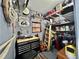 Organized storage room with shelving, tool storage, and vintage decor at 102 Dogwood Trl, Leesburg, FL 34748