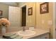 Bathroom vanity with mirror, natural light, neutral paint and door to ensuite bedroom at 1070 Pinewood Pl, The Villages, FL 32162