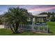 Charming home with lush lawn and a screened-in lanai at 1070 Pinewood Pl, The Villages, FL 32162