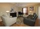 Comfortable living room with a fireplace and wood flooring at 1070 Pinewood Pl, The Villages, FL 32162