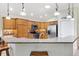 The kitchen is equipped with granite countertops, custom backsplash and stainless-steel appliances at 1182 Allaire Loop, The Villages, FL 32163