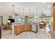 The kitchen offers granite countertops, stainless steel appliances and an open layout, great for gatherings and entertaining at 1182 Allaire Loop, The Villages, FL 32163