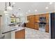 Modern kitchen with stainless steel appliances, granite countertops, and an open design perfect for entertaining at 1182 Allaire Loop, The Villages, FL 32163