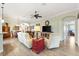 Comfortable living room area with a ceiling fan and views into other living spaces at 1182 Allaire Loop, The Villages, FL 32163