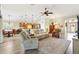 Spacious open-concept layout connecting the living room, kitchen, and dining area at 1182 Allaire Loop, The Villages, FL 32163