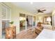 Bright sunroom featuring large sliding glass doors to the backyard, a ceiling fan, and tile flooring at 1182 Allaire Loop, The Villages, FL 32163