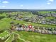 A bird's-eye view of the property, showcasing its prime location within a picturesque golf course community at 11820 Se 178Th St, Summerfield, FL 34491