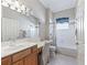 Bright bathroom featuring a vanity, sink, toilet and bath/shower combination at 11820 Se 178Th St, Summerfield, FL 34491