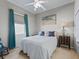 Cozy bedroom with neutral walls, a ceiling fan, and beachy decor, perfect for relaxing at 11820 Se 178Th St, Summerfield, FL 34491
