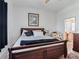 Bedroom featuring large window, ceiling fan and access to the bathroom at 11820 Se 178Th St, Summerfield, FL 34491