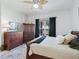 Bedroom featuring natural light, ceiling fan and comfortable bed at 11820 Se 178Th St, Summerfield, FL 34491