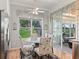 Sunlit breakfast nook with floral patterned chairs and views of backyard at 11820 Se 178Th St, Summerfield, FL 34491