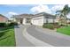 Well-maintained home with a stylish driveway and lush landscaping at 11820 Se 178Th St, Summerfield, FL 34491