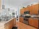 Charming kitchen featuring stainless steel appliances and granite countertops at 11820 Se 178Th St, Summerfield, FL 34491