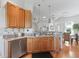 Open kitchen layout showing the breakfast bar and stainless steel appliances at 11820 Se 178Th St, Summerfield, FL 34491