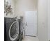 Functional laundry room with modern washer and dryer units for efficient laundry care at 11820 Se 178Th St, Summerfield, FL 34491