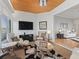 Bright sunroom with wood ceiling, comfortable seating, and views to other rooms at 11820 Se 178Th St, Summerfield, FL 34491