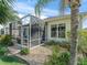 Charming sunroom featuring a screened-in enclosure, perfect for enjoying the outdoors in a comfortable setting at 11820 Se 178Th St, Summerfield, FL 34491