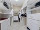 Spacious walk-in closet with built-in shelves and ample storage at 11820 Se 178Th St, Summerfield, FL 34491