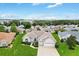 Well-manicured lawn of a charming home featuring a two-car garage in a beautiful community at 11884 Se 179Th St, Summerfield, FL 34491