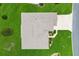 Aerial view of a house showing the roof with lush green lawns and landscaping around the property at 11884 Se 179Th St, Summerfield, FL 34491