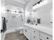 Modern bathroom featuring a glass shower, sleek fixtures, and a bright white vanity with lots of storage at 11884 Se 179Th St, Summerfield, FL 34491