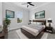 Bedroom featuring neutral color scheme, decorative art, and a large window offering natural light at 11884 Se 179Th St, Summerfield, FL 34491