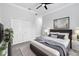 Well-lit bedroom with calming color palette, decorative wall art, and closet for organized storage at 11884 Se 179Th St, Summerfield, FL 34491