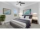 Bedroom with a comfortable bed, serene decor, and soft lighting to create a relaxing atmosphere at 11884 Se 179Th St, Summerfield, FL 34491