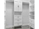 Organized walk-in closet with custom built-in shelving, cabinets and drawers providing ample storage at 11884 Se 179Th St, Summerfield, FL 34491