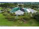 Exterior view of the Stonecrest community center featuring lush landscaping and palm trees at 11884 Se 179Th St, Summerfield, FL 34491