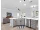 Kitchen with a peninsula island, stainless steel appliances, and lots of natural light at 11884 Se 179Th St, Summerfield, FL 34491