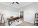 Office space boasting a view of the open floor plan, sleek lighting, and modern desk with decorative shelving at 11884 Se 179Th St, Summerfield, FL 34491