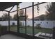 View of backyard featuring decorative butterflies and wind chimes, enclosed with a white privacy fence at 1231 Merion Dr, Mount Dora, FL 32757