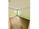 Empty bedroom featuring neutral carpet, a window, and light colored walls at 1231 Merion Dr, Mount Dora, FL 32757
