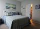 Bedroom with ocean themed decor, carpeted floors and closet at 1231 Merion Dr, Mount Dora, FL 32757