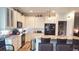 Well-appointed kitchen with white cabinets, granite countertops, and stainless-steel appliances at 1231 Merion Dr, Mount Dora, FL 32757