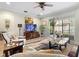 Bright living room with sliding glass doors and a view to the exterior at 1231 Merion Dr, Mount Dora, FL 32757