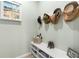 Functional mudroom with a bench, storage cubbies, and wall hooks at 1231 Merion Dr, Mount Dora, FL 32757
