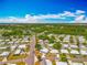 Expansive aerial view of a sprawling neighborhood featuring well-maintained homes and beautiful, mature landscaping at 1236 Elkhart Cir, Tavares, FL 32778