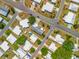 An aerial perspective of the community, highlighting the tidy arrangement of homes and roads at 1236 Elkhart Cir, Tavares, FL 32778