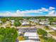A panoramic view of the property and its community, with lush greenery and blue skies at 1236 Elkhart Cir, Tavares, FL 32778