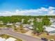 Charming neighborhood captured from above with cozy homes surrounded by mature trees and colorful landscapes at 1236 Elkhart Cir, Tavares, FL 32778