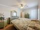 Bedroom featuring vintage furniture, a window for natural light, and a ceiling fan at 1236 Elkhart Cir, Tavares, FL 32778