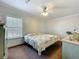 This comfortable bedroom features a large window for natural light and a cooling ceiling fan at 1236 Elkhart Cir, Tavares, FL 32778
