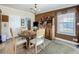 Cozy dining area features a round table, stylish hutch, and natural light from the window at 1236 Elkhart Cir, Tavares, FL 32778