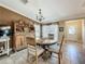 Cozy dining room featuring a round table, china cabinet, and natural light at 1236 Elkhart Cir, Tavares, FL 32778