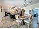 Dining table that provides access to the kitchen, living room, and office at 1236 Elkhart Cir, Tavares, FL 32778