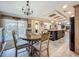 Dining area showcasing the kitchen and living room in an open concept design at 1236 Elkhart Cir, Tavares, FL 32778